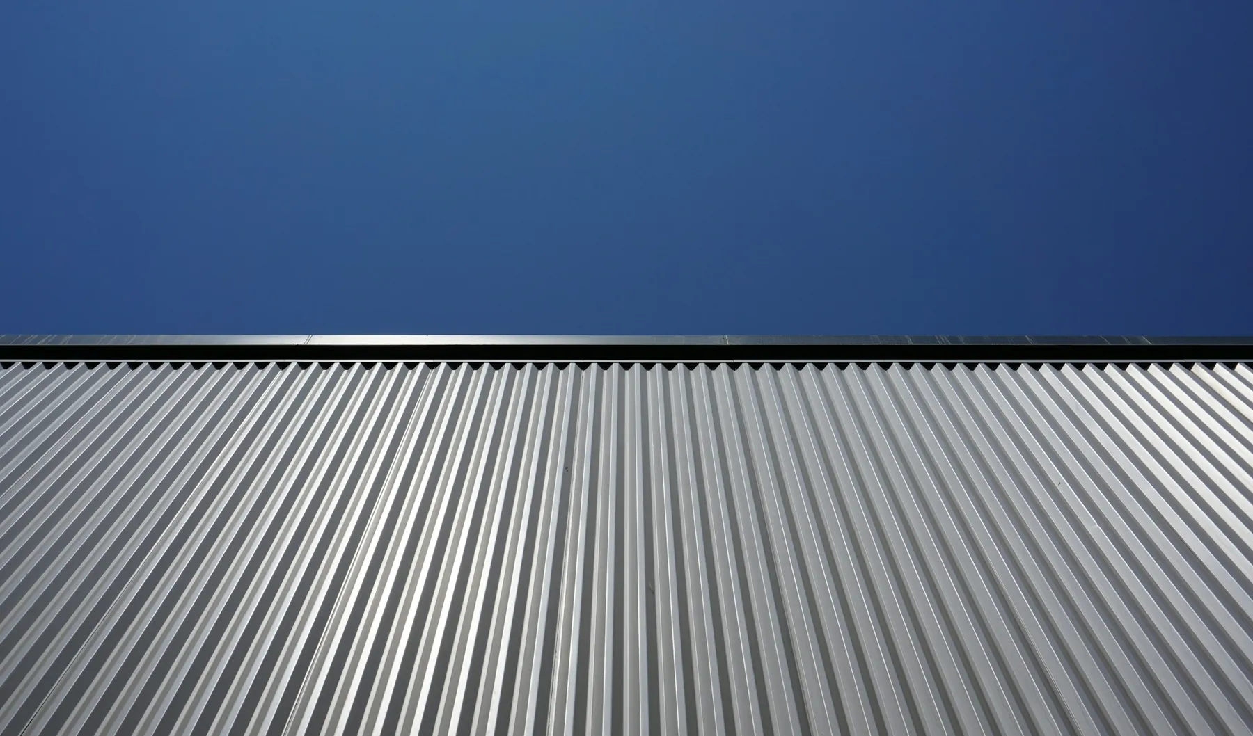 Standing-seam metal roof against the sky