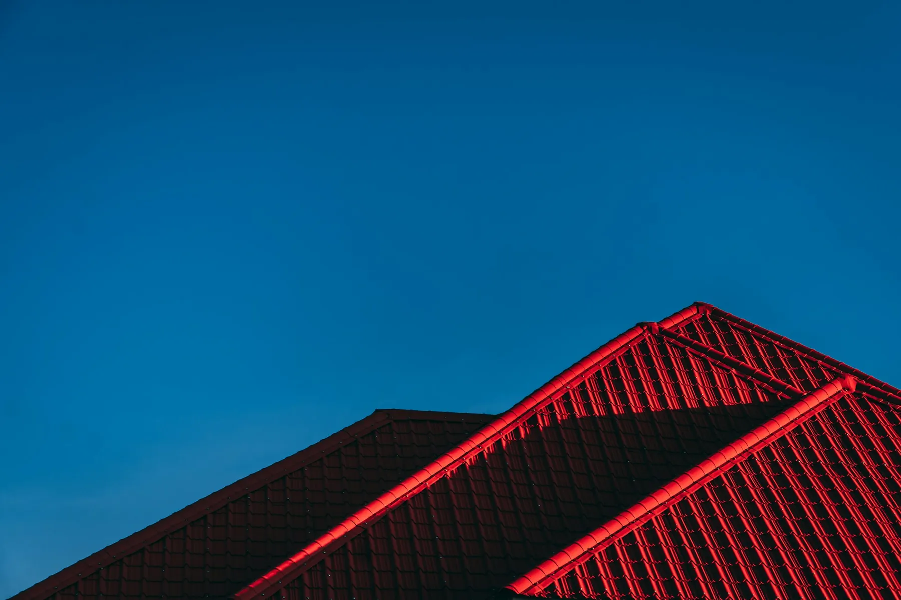 Dramatic South Florida rooftop against a blue sky